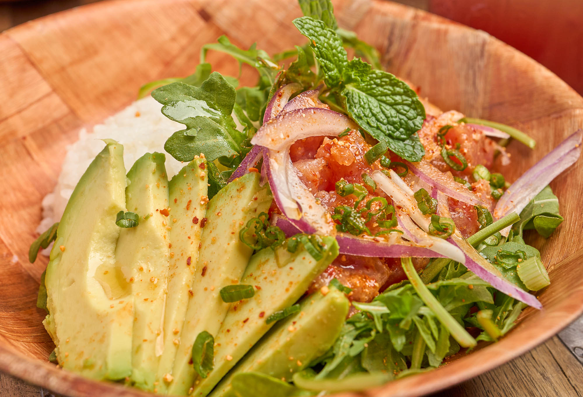 A larb, poke, and tuna bento box