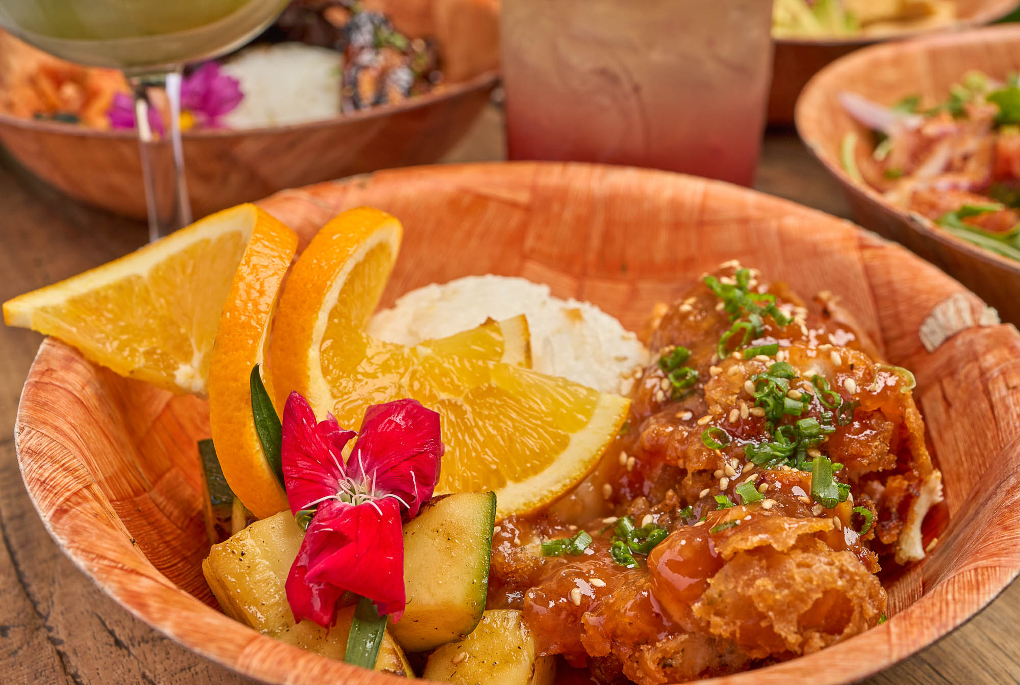 An orange chicken bento box